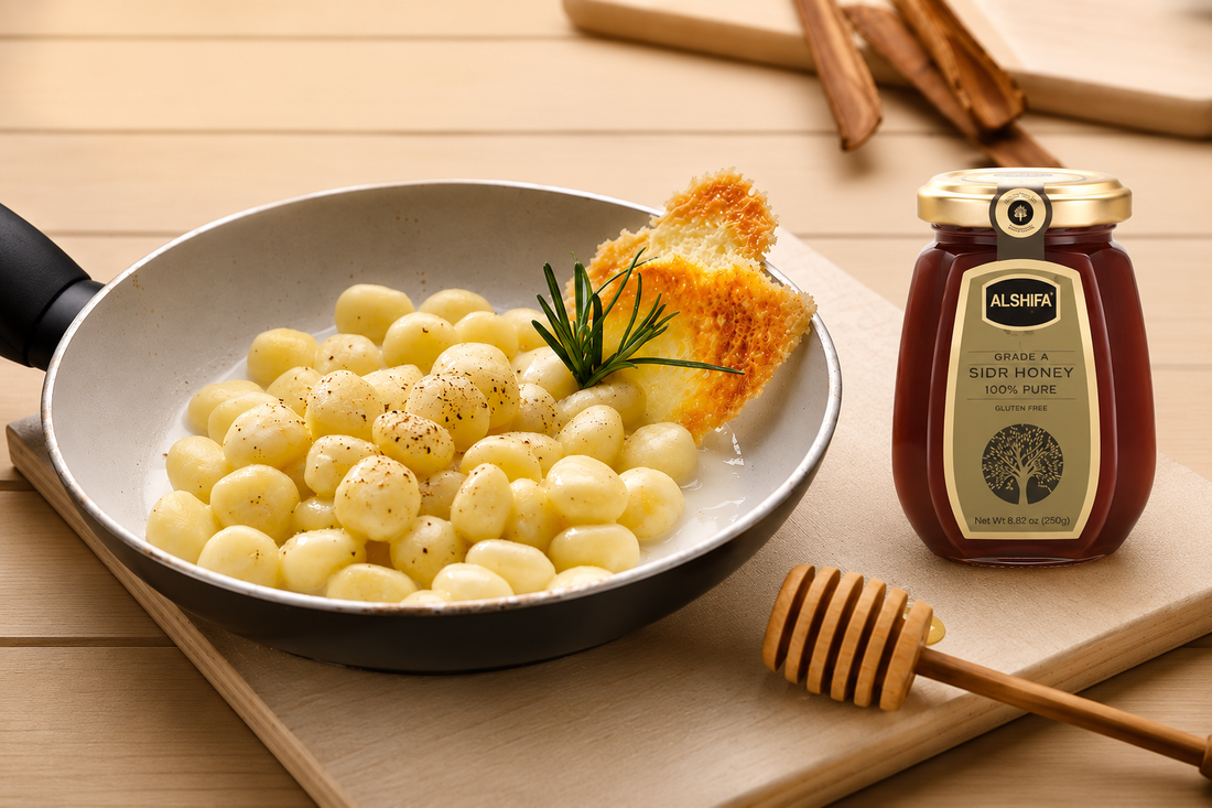 Gnocchi in creamy Gorgonzola sauce with rosemary and toasted bread beside a jar of ALSHIFA Sidr Honey